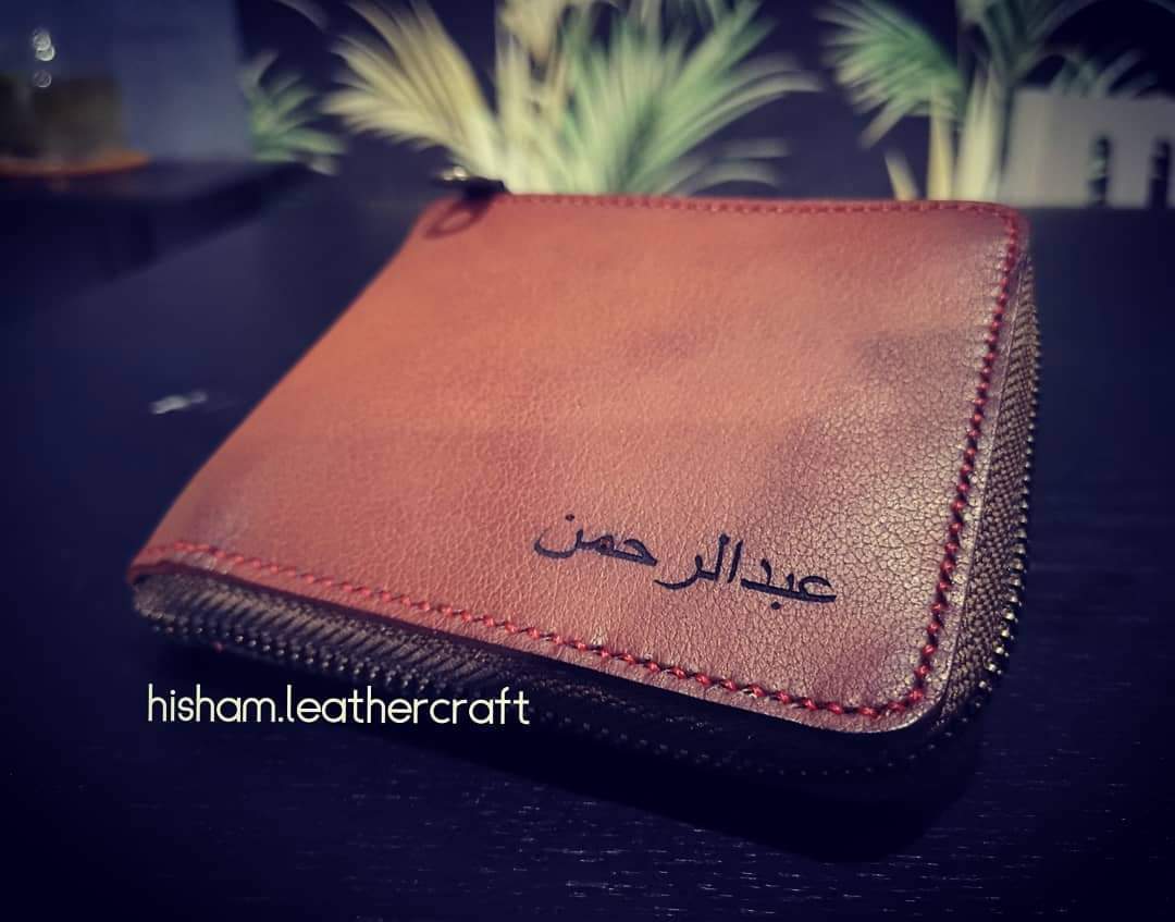 LEATHER ZIPPED BIFOLD T WALLET